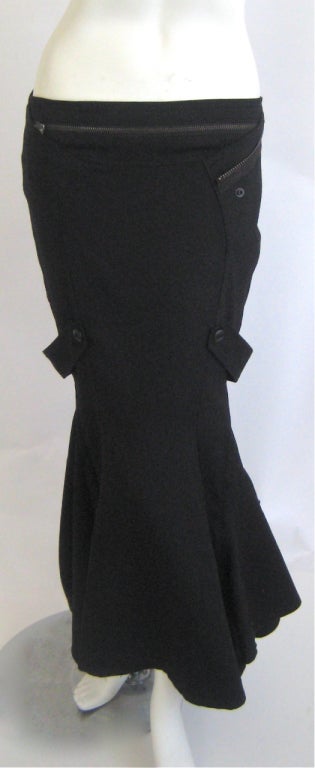 100% wool 
Rayon silk lining
Working zipper in back
Color is a true rich black .some photos have been lightened to show detail
