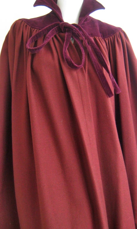 lovely ysl cape 
burgundy wool or wool cashmere blend
velveteen yoke 
bow tie closure
no armholes
no pockets