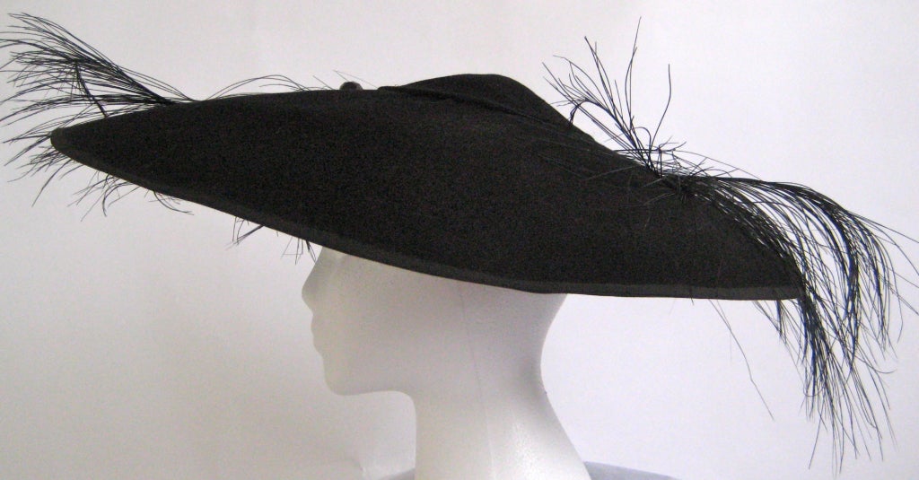 Women's 1940s gilbert adrian black flying saucer hat with feather