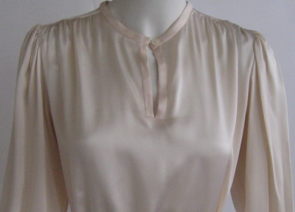Ivory silk with very pale blush pink yoke
One button closure at neck 
Wide sash belt