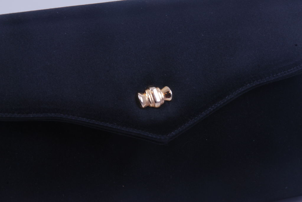 Black satin Tiffany evening bag from the 1990's. This bag is elegant in its simplicity. The lining is a vibrant red satin.