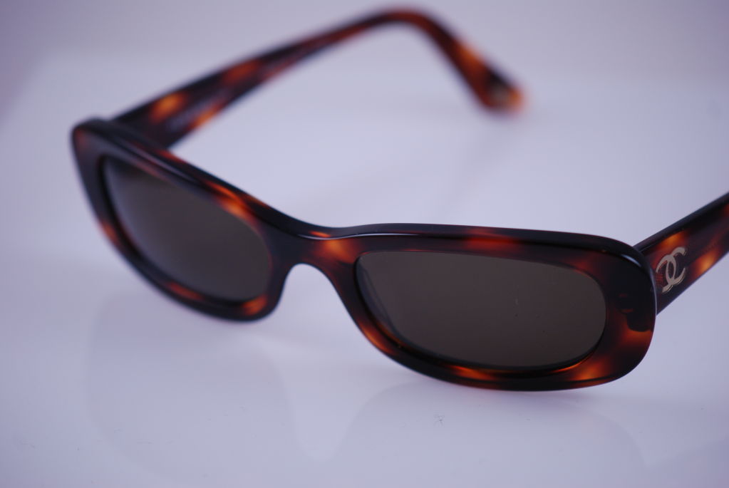 Vintage Chanel tortoise shell sunglasses with brown lenses. There is also 