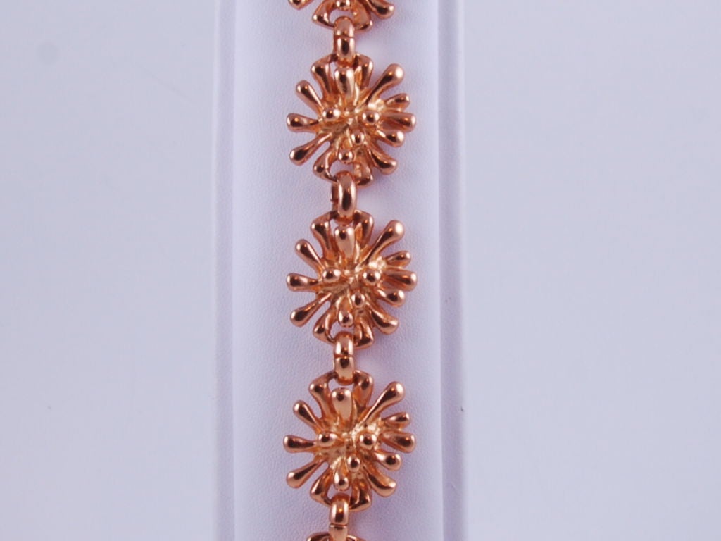 Gold tone Christian Lacroix toggle bracelet. This is a design called Anemone. Bracelet is 7.5