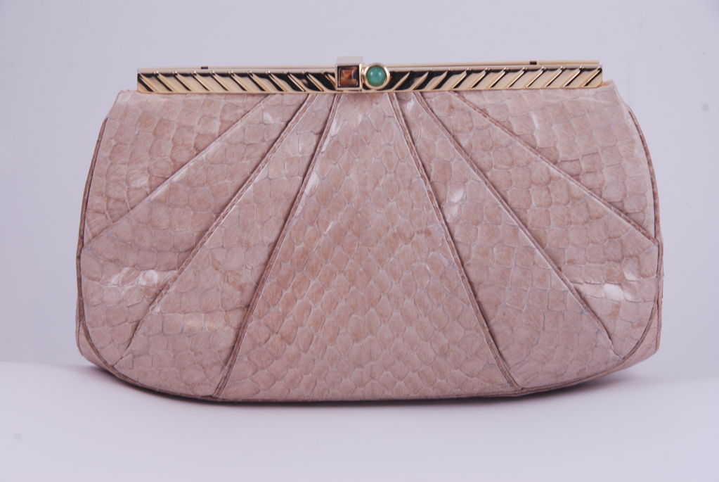 Tan python Judith Leiber bag from the 1970's with a tiger eye and jade clasp. This is one of the simpler Leiber bags made.<br />
The clasp open by lifting the jeweled part upwards. Clasp works well and closes securely. Frame is gold tone metal.