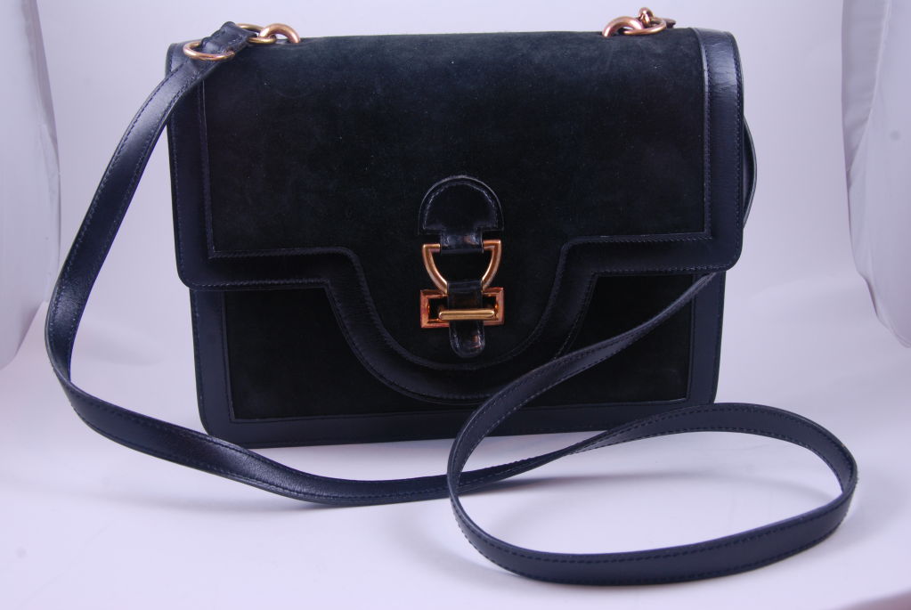 Hermes black suede, leather trimmed, shoulder bag from the 1960's. Gussets are black leather.<br />
<br />
Bag was retailed by Bonwit Teller in their Hermes Boutique. The shoulder strap is adjustable and measures 41.5