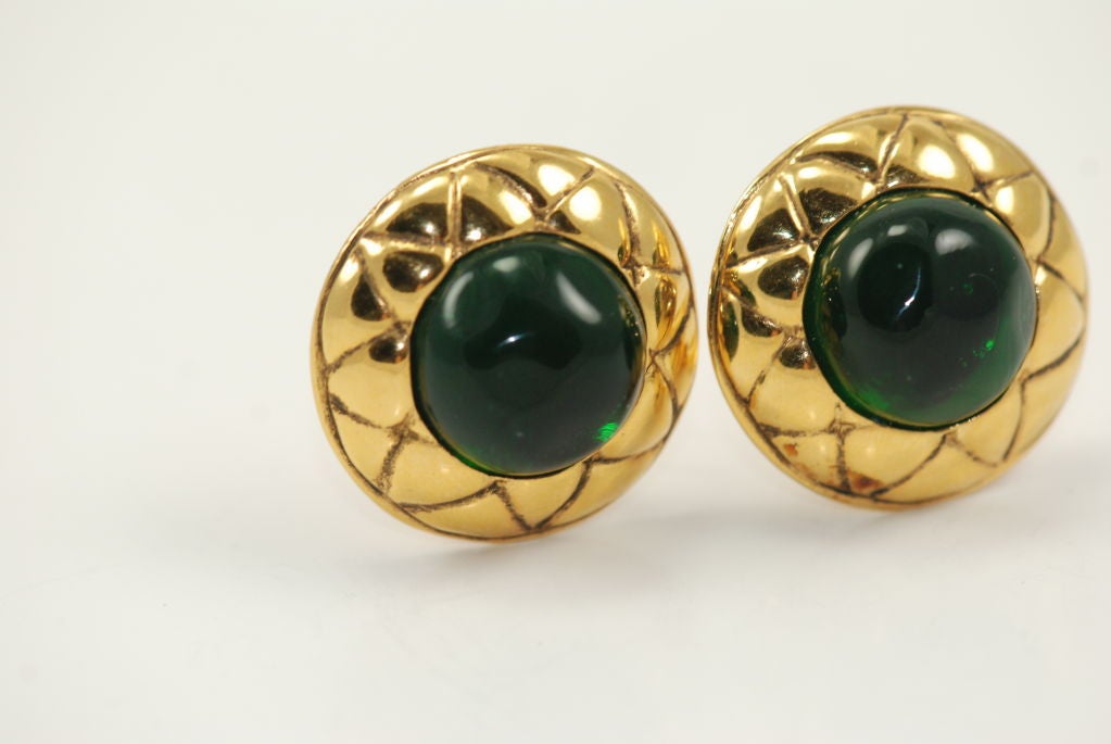 Chanel clip on earrings from the 1970 - 80's with center of green poured glass. 1