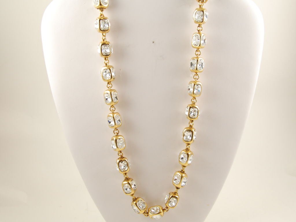 Beautiful, long Chanel rhinestone necklace from Season 23, which would date this piece to the 1980's. Each link has a gold tone  