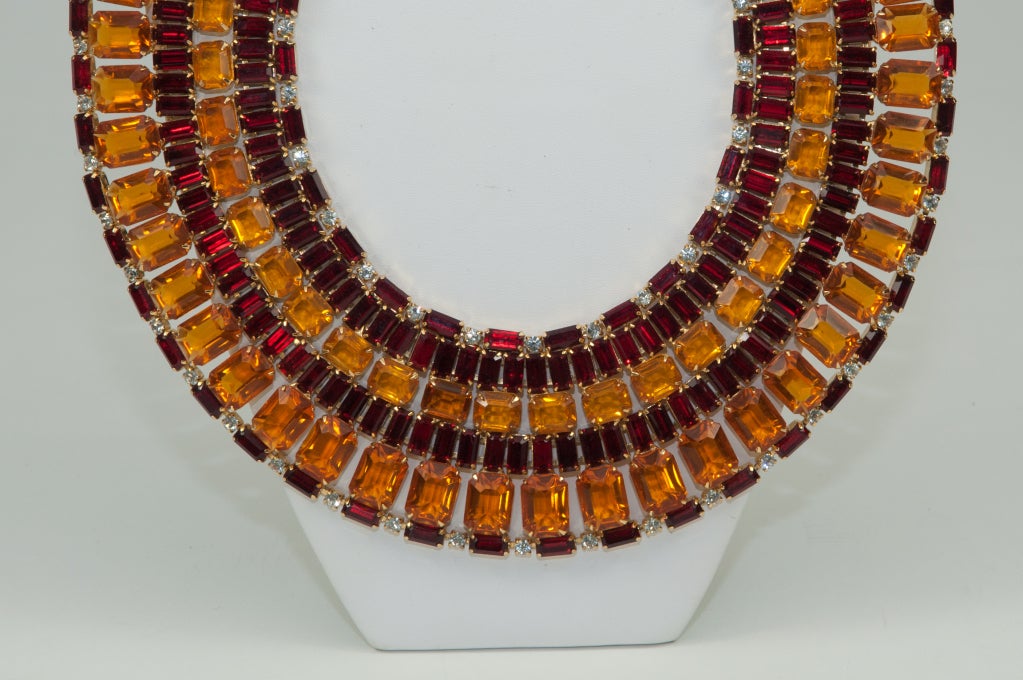 Wide rhinestone collar necklace made with topaz and ruby colored rhinestone. Necklace is 2.25
