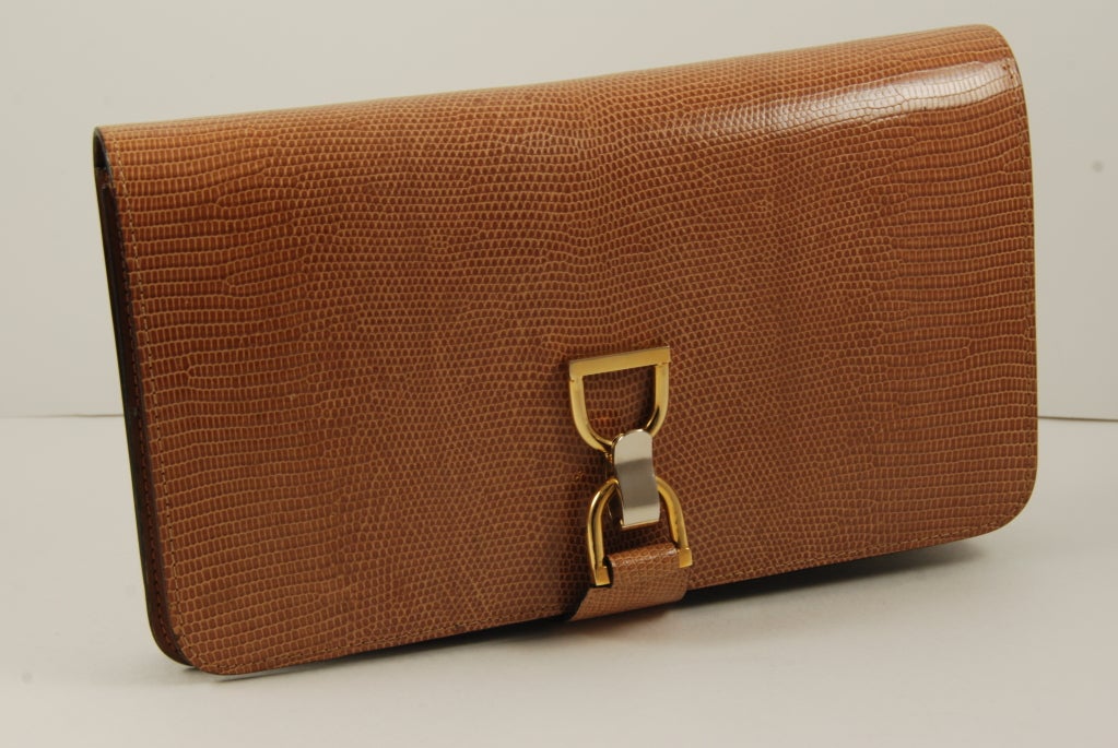 1970-80's tan - light brown lizard bag which can be used as a clutch or a shoulder bag. Strap is about 40