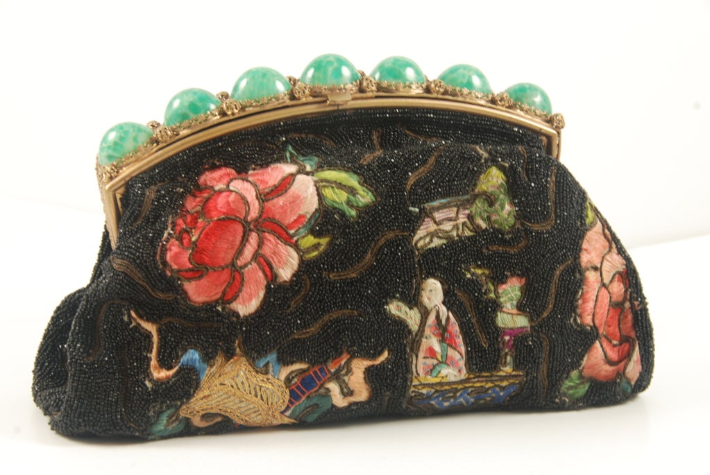Exquisite French beaded and embroidered evening bag with green stones in the frame. The hand embroidery  is in the Asian motif. The beads are black.