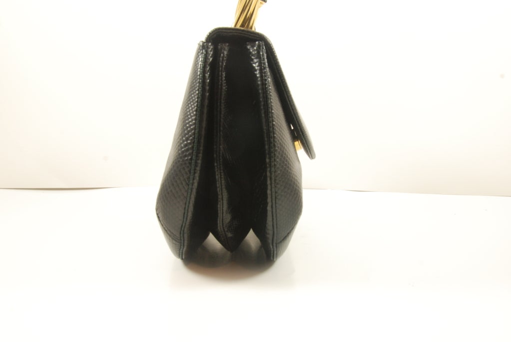 Judith Leiber black karung (lizard) bracelet bag. The handle when worn over the arm looks like you are wearing a great bracelet. The 