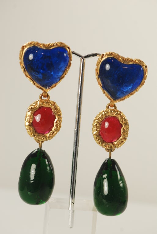 Chanel hanging gripoix earrings in green, carnelian and blue glass. The metal work in which the stones are set in give them a baroque look. The three segments are free handing which gives the earring great movement when worm. They are from season