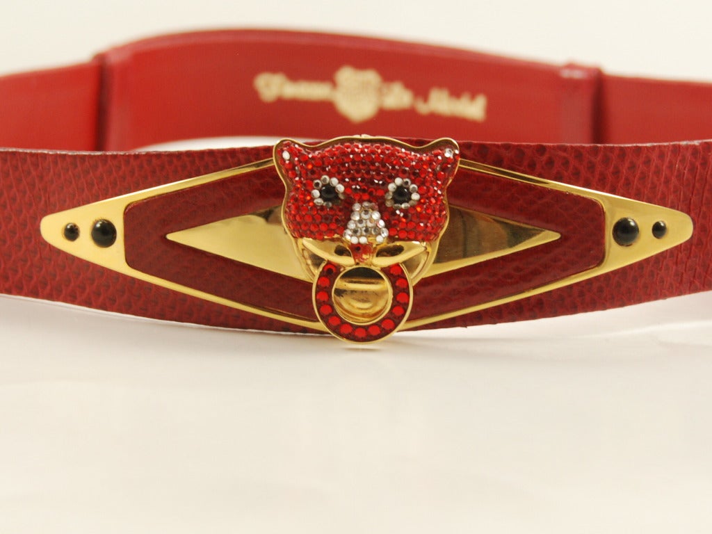 Vibrant red lizard adjustable belt with center jeweled red lion or panther head and onyx stones. The lions head is 2