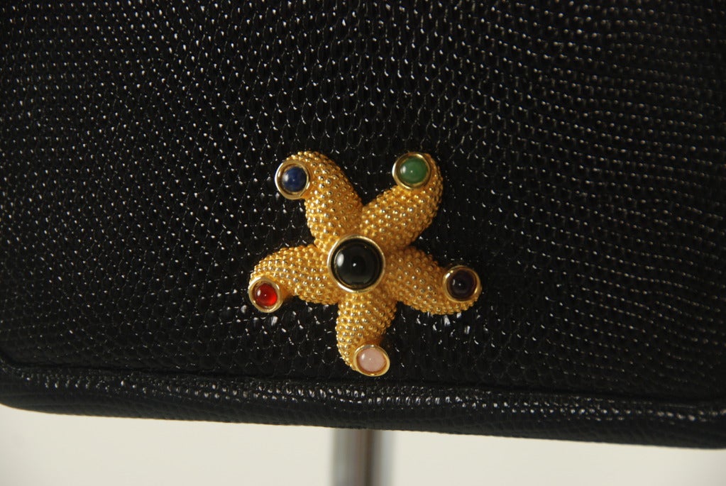 Black karung (lizard) Judith Leiber handbag from the 1980s with a starfish clasp with semi-precious stones.   Stones are onyx, jade, garnet, amethyst, rose quartz and lapis. Starfish measures 2