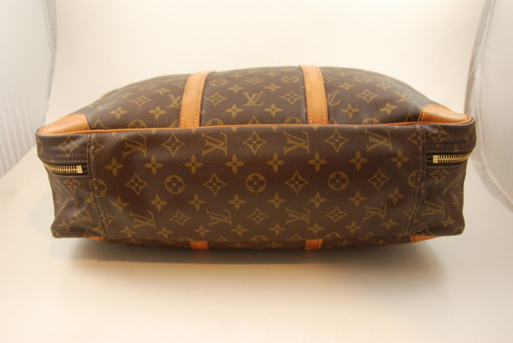 Louis Vuitton Sirius Monogram carry on size suitcase. This is the smallest bag in the Sirius series and it was designed to easily fit into the overhead storage bin on an airplane. The bag closes with a sturdy Vuitton double zipper and comes with the