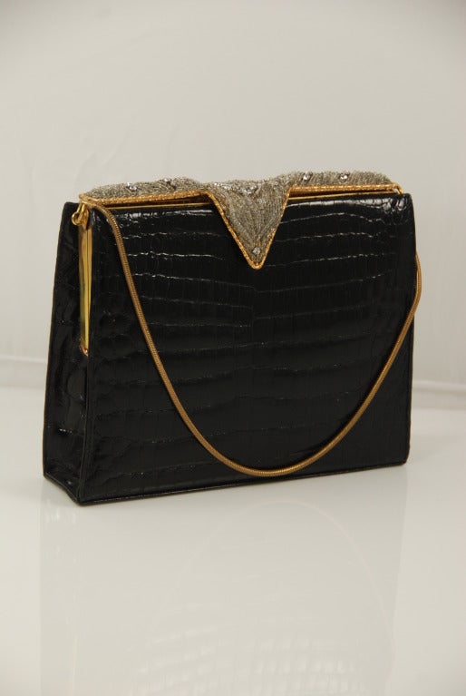 Wonderful black alligator evening bag by Lucille of Paris, This bag dates from the 1950s-60s when Lucille of Paris was sold by the most elegant stores, such as Bergdorf Goodman. The skins are glossy and all the beads and rhinestones are present.