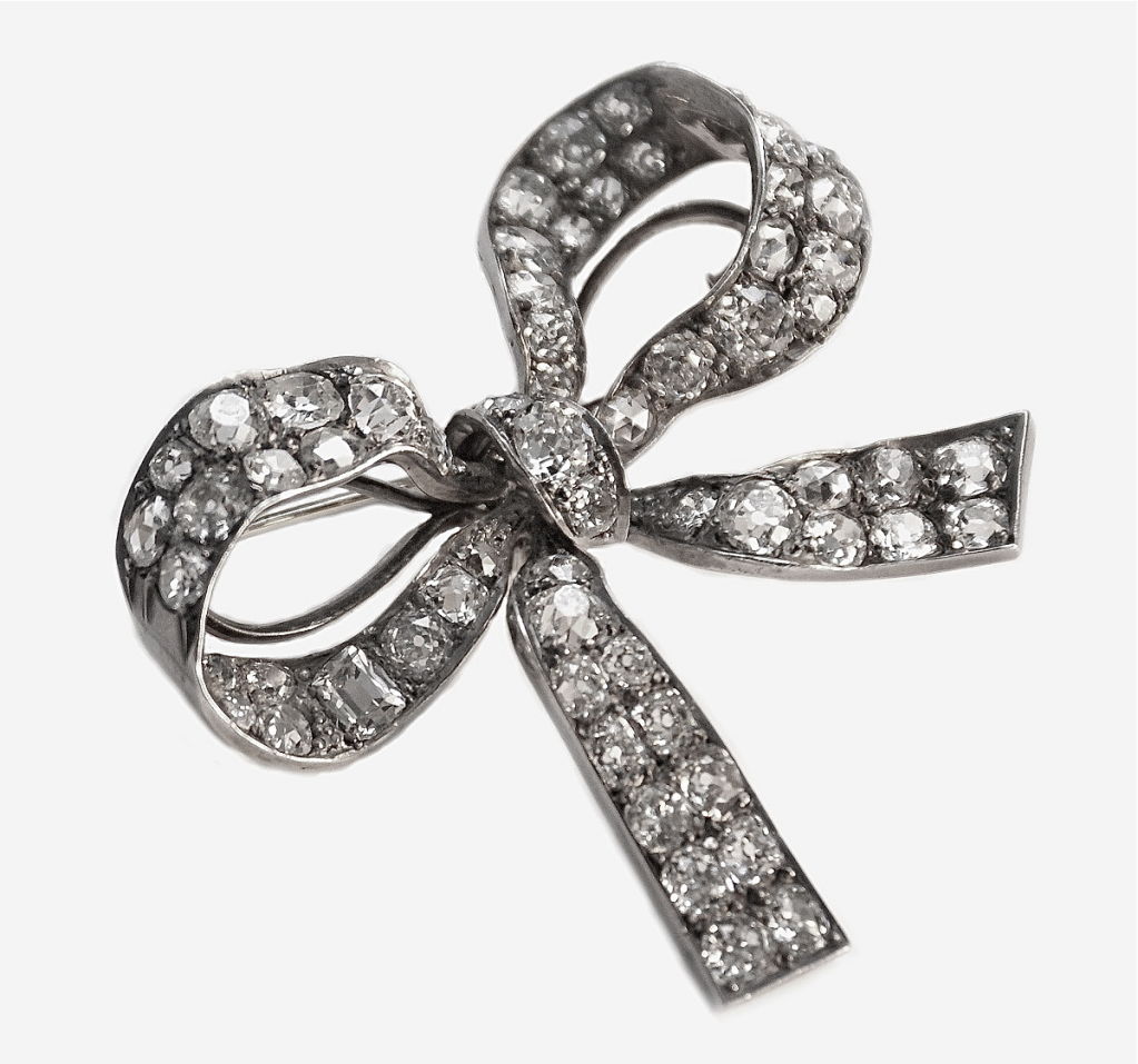 An Elegant Victorian Diamond Bow Brooch set with eleven carats of old European cut diamonds. Graceful and elegant