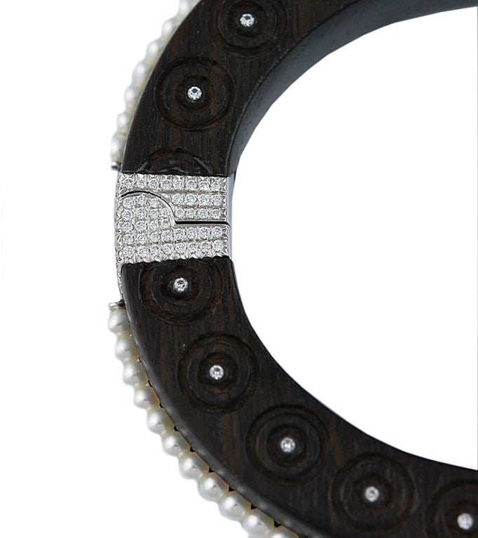 Carved Ebony Bangle set with Diamonds and Pearls mounted in 18kt white gold and hinged and safety closure