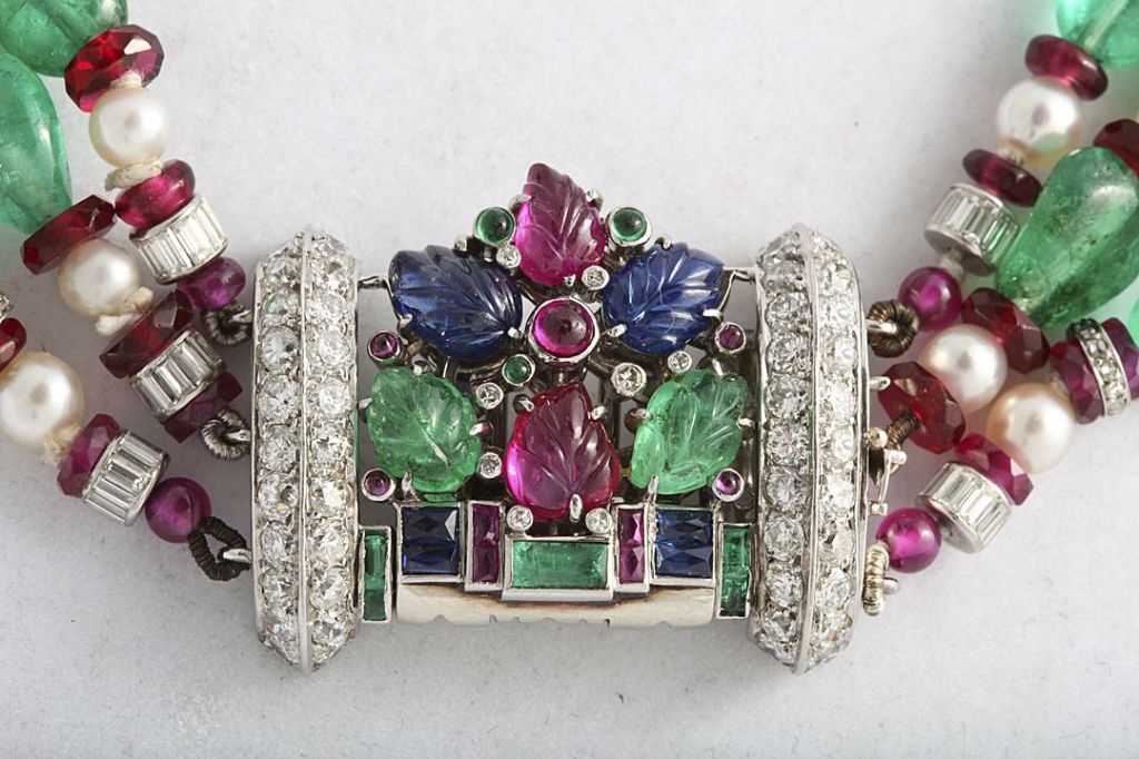 Beautiful Art Deco Fruit Salad necklace, the centre clip detaches and may be worn separately. The necklace of made of Columbian emerald beads, rubies, natural pearls and diamond rondels