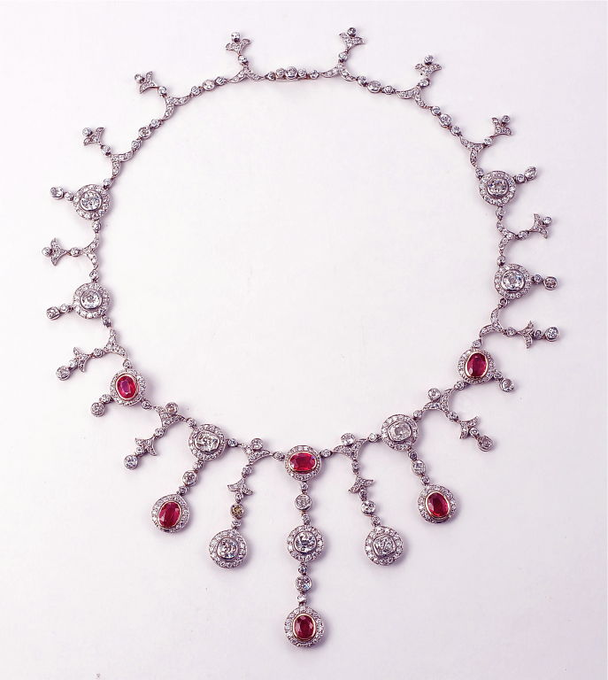 A very fine Edwardian Burma ruby and diamond drop fringe necklace of circular motifs.