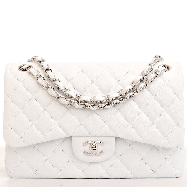 Chanel white quilted caviar leather Jumbo classic 2.55 double flap bag with silvertone hardware, front flap with CC turnlock closure, half moon back pocket and adjustable interwoven silvertone chain link and white leather shoulder/crossbody strap.