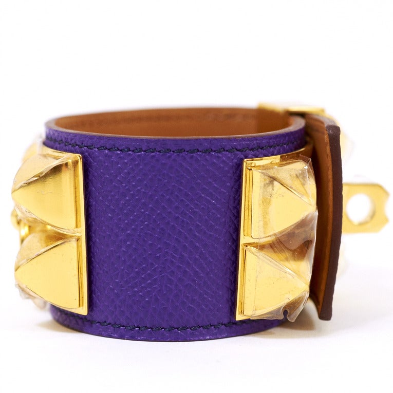 Hermes Collier de Chien Crocus epsom leather bracelet size Small with gold plated pyramid studs and ring. Adjustable push lock closure. Plastic on hardware. 

Collection: P in a square (2012)

Condition: Pristine; store fresh