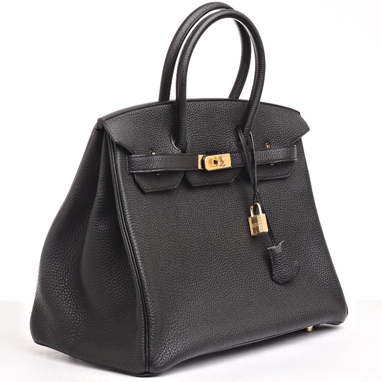 Hermes Black togo Birkin 35cm with tonal stitching, gold hardware, double rolled handles, front toggle closure, clochette with lock and 2 keys. Interior is lined in Black chevre and features: one zip pocket with Hermes engraved pull and open pocket