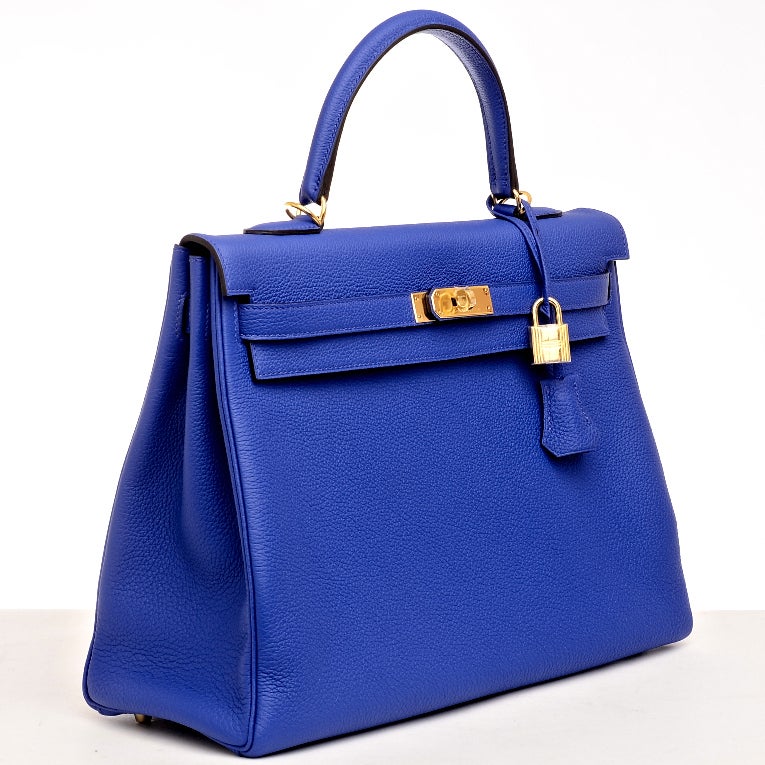 Hermes Blue Electric Kelly 35cm in rich togo (bull) leather with gold hardware.

The Hermes Kelly bag, like its sister bag -- the Birkin -- is a coveted and scarce bag. Like its muse, Grace Kelly, this bag is the definition of timeless elegance.