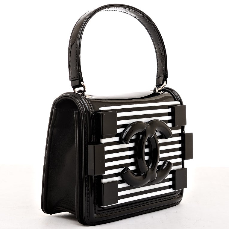 Chanel black and white striped patent leather Boy Brick crossbody bag with silvertone hardware, front large black patent CC logo on striped plexi glass plate with surrounding 6 stud detail, lambskin leather sides and back, hidden snap closure, flat