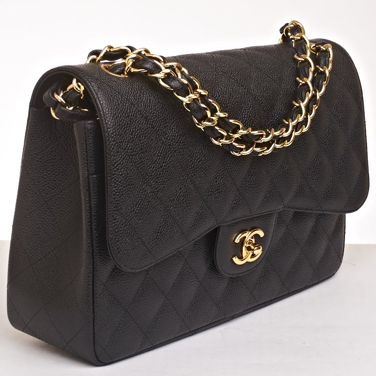 Chanel black Jumbo Classic 2.55 double flap bag of quilted caviar leather with gold tone hardware.

Named 2.55 to honor the bag's creation in February 1955, the iconic Chanel bag was a modification of the bag Coco Chanel originally designed in
