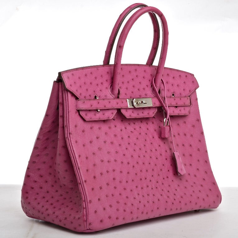 Hermes rare Fuchsia Ostrich Birkin 35cm with tonal stitching, palladium hardware, front toggle closure, and clochette with lock and two keys, double rolled handles, Fuchsia chevre lining with one zip pocket with Hermes engraved pull and open pocket