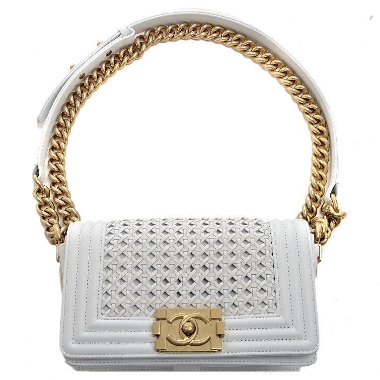 Chanel white braided sheepskin leather Reverso boy flap bag with antiqued goldtone hardware, gold leather trim on braided section and base, front flap with CC push lock closure, and antiqued goldtone chain link and white leather padded shoulder