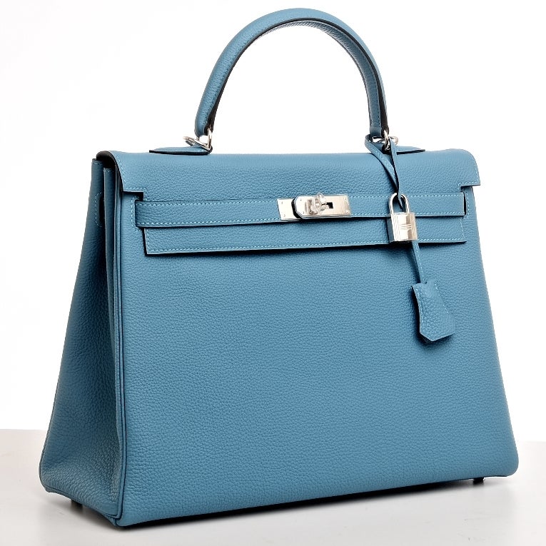 Hermes Turquoise togo leather Kelly 35cm with tonal stitching, palladium hardware, front toggle closure, clochette with lock and 2 keys, single rolled handle, removable shoulder strap and turquoise chevre lining with one zip pocket with Hermes