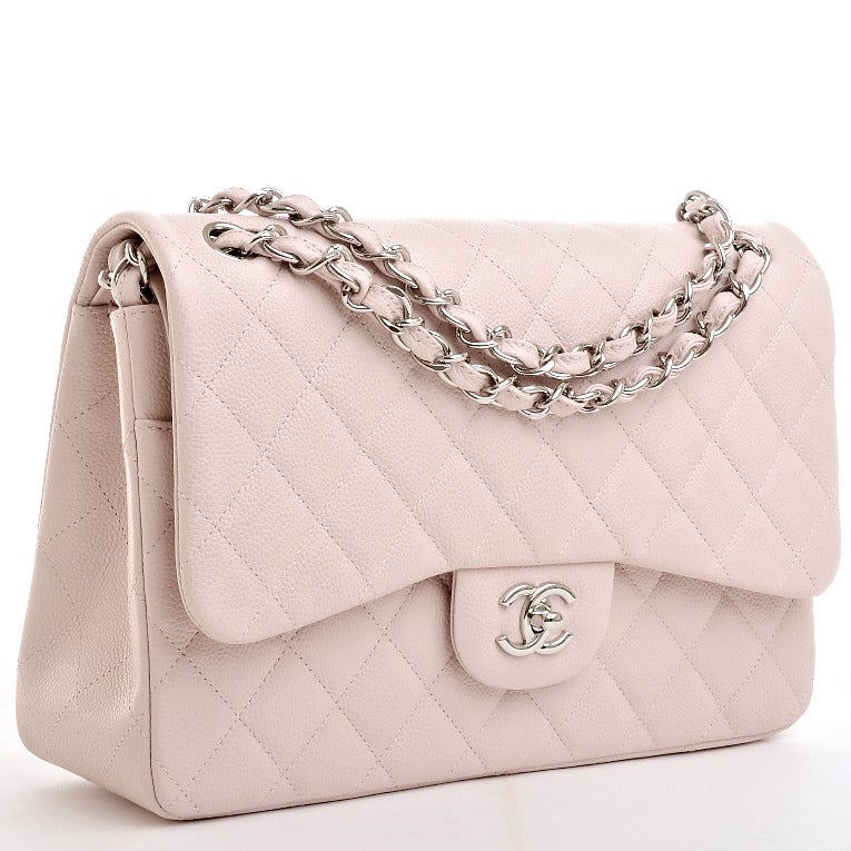 Chanel baby pink quilted caviar leather Jumbo classic 2.55 double flap bag with silvertone hardware, front flap CC turnlock closure, half moon back pocket, adjustable interwoven silvertone chain link and pink leather shoulder/crossbody strap, and