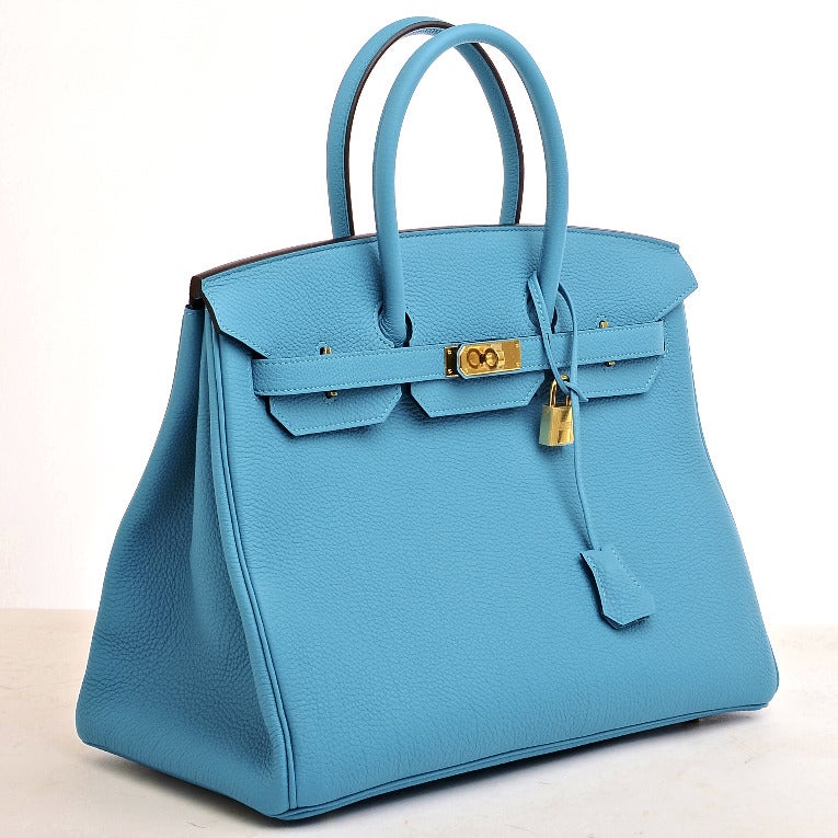 Hermes Turquoise Togo Birkin 35cm with tonal stitching, gold hardware, front toggle closure, clochette with lock and two keys, double rolled handles, turquoise chevre lining with one zip pocket with Hermes engraved pull and open pocket on opposite