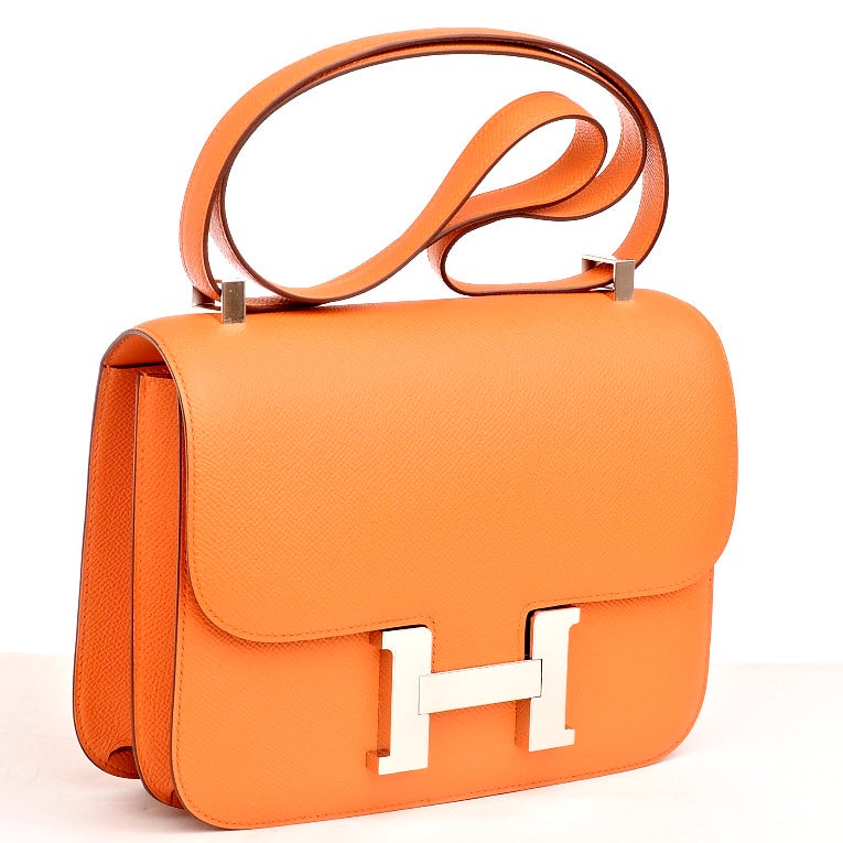 Hermes Orange H epsom leather Constance 24cm with tonal stitching, palladium hardware, and adjustable shoulder strap.

Collection: Q square (2013)

Origin: France

Condition: Pristine; store fresh condition

Accompanied by: Box, dustbag,
