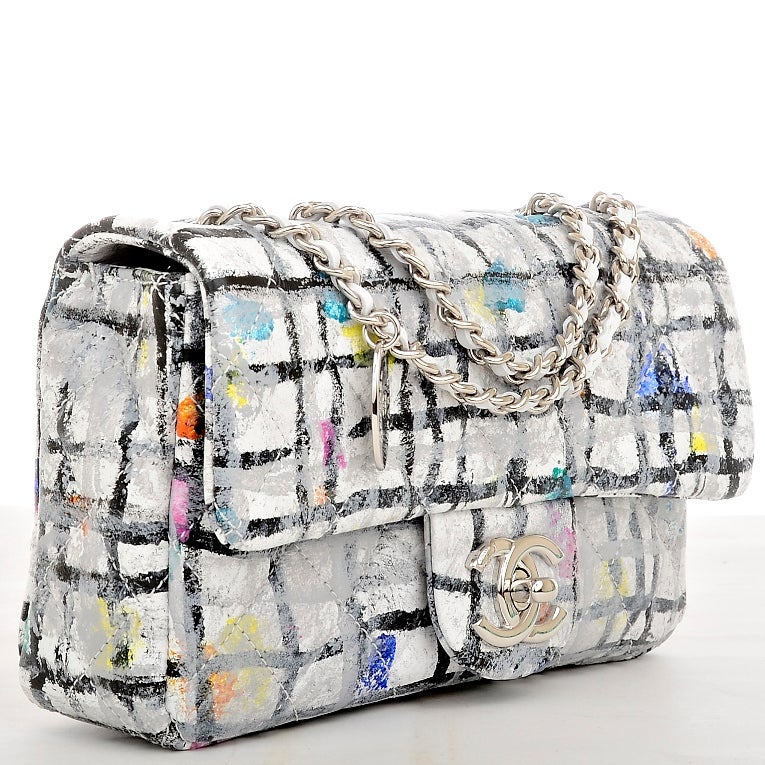 Chanel multi-color quilted calfskin leather Graffiti Small flap bag featuring all over colorful black and white pattern with mutlicolor splashes of artful graffiti paint (in yellow, pink, blue, green, orange and teal) with silvertone hardware, front