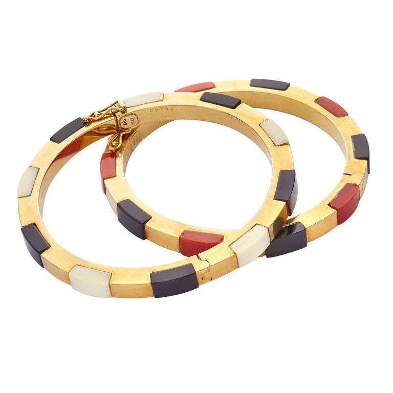 Pair of Cartier Ivory Onyx Coral Gold Bangles