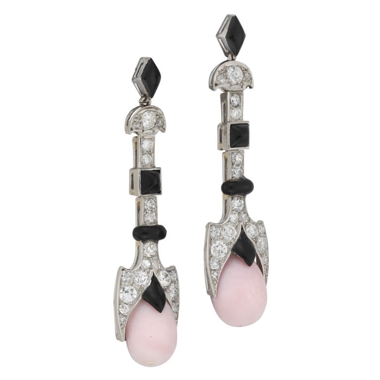 A fine pair of La Cloche Art Deco conch pearl, enamel and diamond drop earrings, the conch pearls suspended from a diamond and black enamel geometric top, by LaCloche Freres, circa 1920s