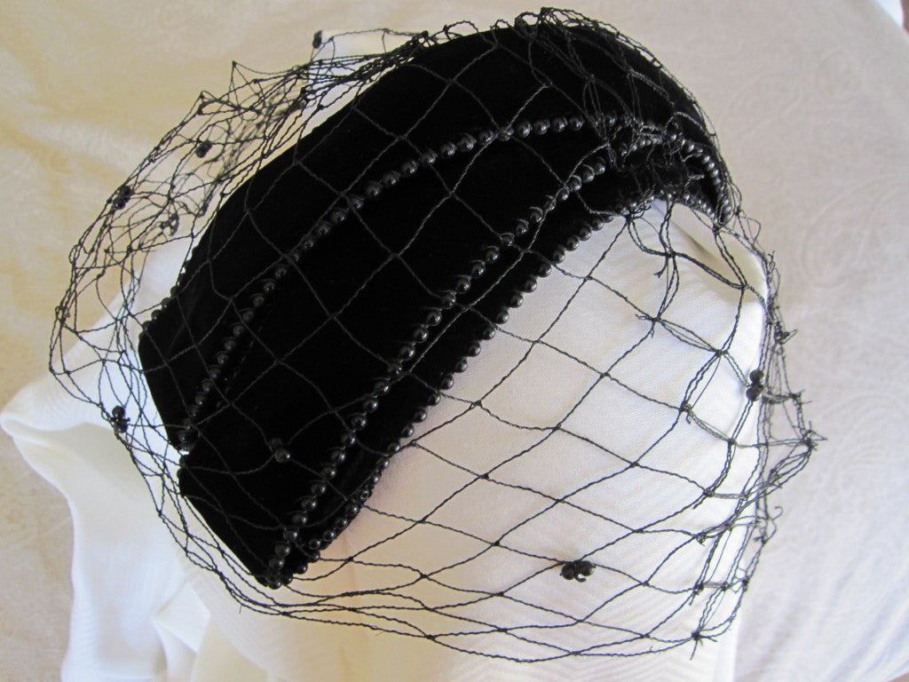 Bes-Ben black velvet beaded hat with veil unworn w tags
Founded by siblings Bess and Benjamin Green-Field, Bes-Ben sold elegant hats to society women and Hollywood starlets from the 1920s through the 1960s. Ben and Bess opened a shop in Chicago on