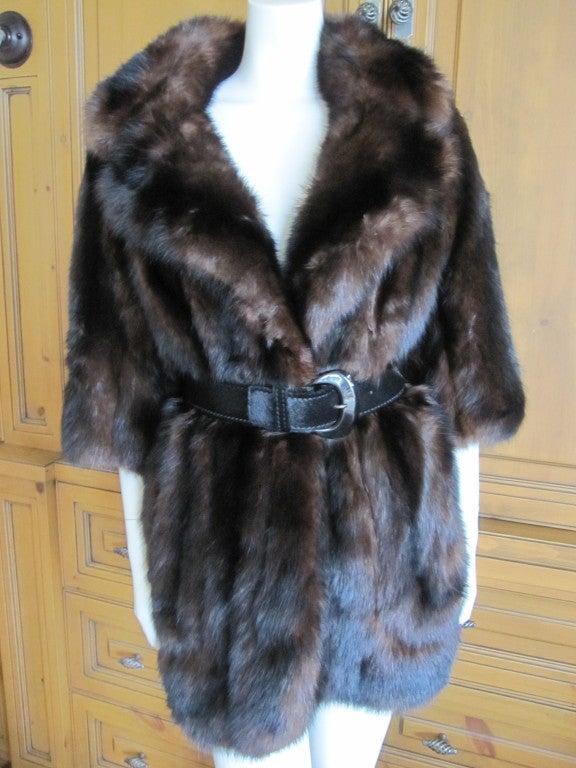 Revillon Paris Russian Sable Coat with Bracelet length sleeves.
There are three fur hook closures, but I belted it.
The belt is for styling purposes only.
Bust 44