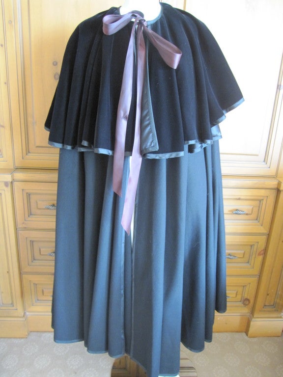 Yves Saint Laurent Rive Gauche vintage Cape
Black wool cape trimmed in grossgrain with a velvet overcape