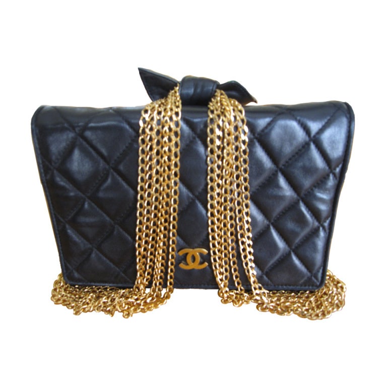 Chanel small quilted black lambskin bag with 6 chain strap