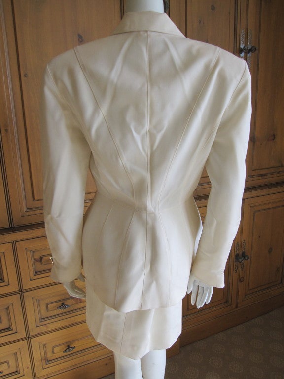 Thierry Mugler crisp white suit with four bold jewels 3