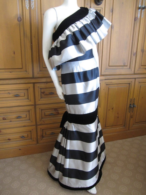 Oscar de la Renta silver and black flamenco dress
This dress is amazing.
It is designed as the off the shoulders, and has two armeholes. It can also be worn with it slipped over to be a one shoulder gown.