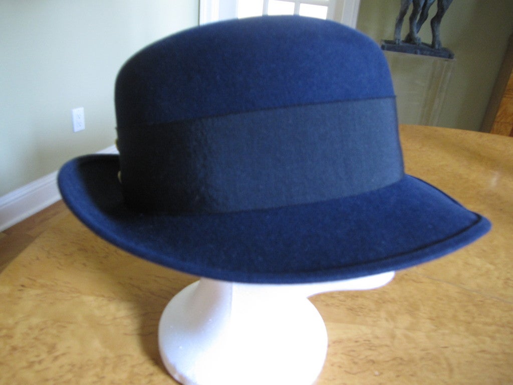 Chanel navy blue fedora with wide Grossgrain band CC buttons