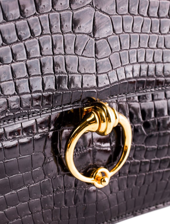Hermès Rare vintage black crocodile Sac Sequana Bag

        Black crocodile skin shoulder bag with gold-tone   hardware, clasp closure, dual compartments and dual

         wall pockets. Includes dust bag. 

        Stamped circle 1989