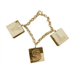 Yves Saint Laurent charm/compact bracelet  New in Box