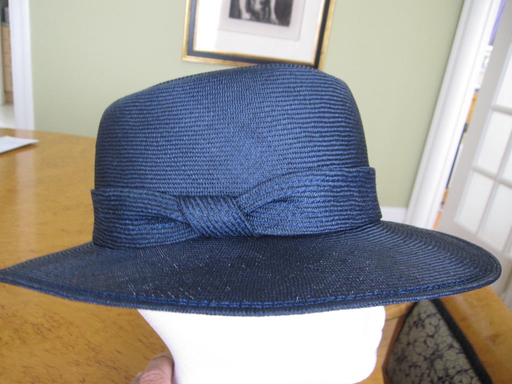 James Galanos navy blue straw wide brim hat.
This hat is perfectly exquisite, as with everything with the Galanos touch
