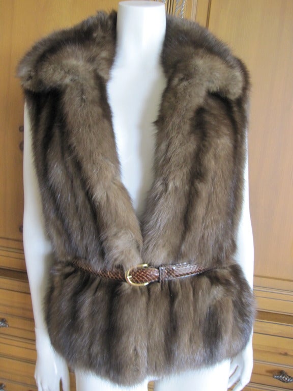 Oscar de la Renta Russian Sable Vest with Oscar de la Renta snakeskin belt
There are four fur hook's for closure, and two pockets lined in velvet.
The inside is a luxurious gray flannel